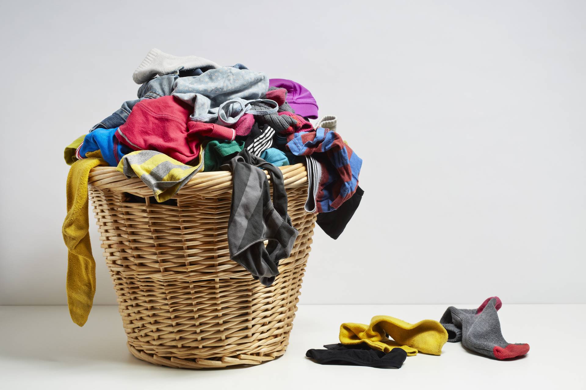 Using laundry baskets or bags for sorting